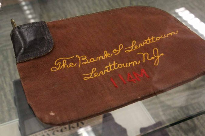 A deposit bag from the Bank of Levittown is one of the surviving artifacts from the years when Willingboro was called Levittown. (Emma Lee/WHYY)