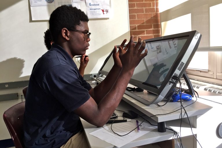 Oswald Darway, a 10th grader at Valley Day School, works with a virtual reality program.