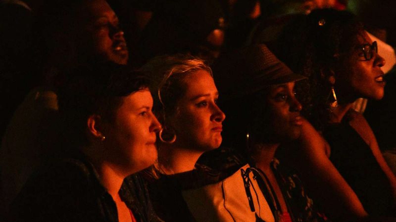 Members of the audience in the seated section enjoy the music during the Fourth of July concert on the Parkway.