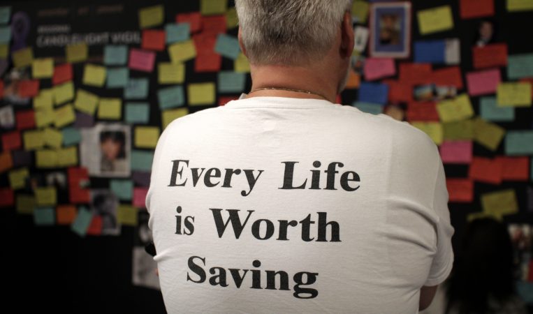 The memories of overdose victims are postedont a Memory Wall at the Regional Candlelight Vigil at Camden Waterfront Stadium on October 14, 2017. (Bastiaan Slabbers for WHYY)