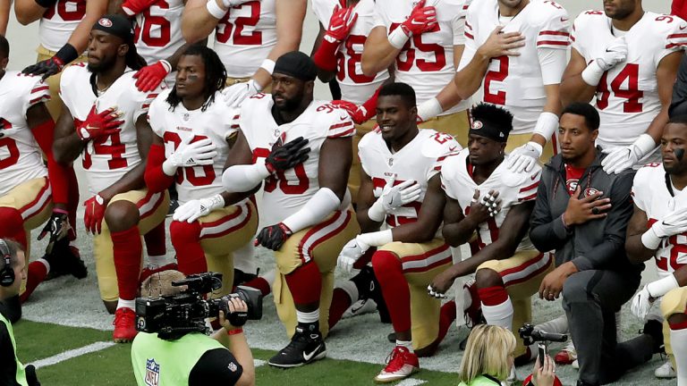 Members of the San Francisco 49ers kneel during the national anthem as others stand prior to an NFL football game against the Arizona Cardinals, Sunday, Oct. 1, 2017, in Glendale, Ariz.