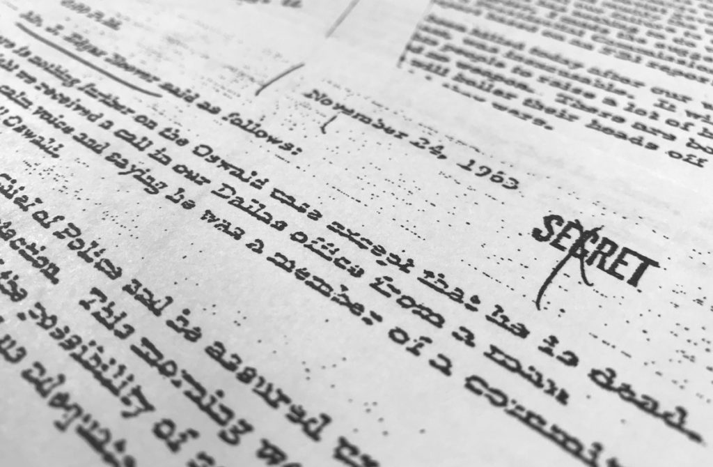 JFK Files Secret files, black and white, typewriter print on paper