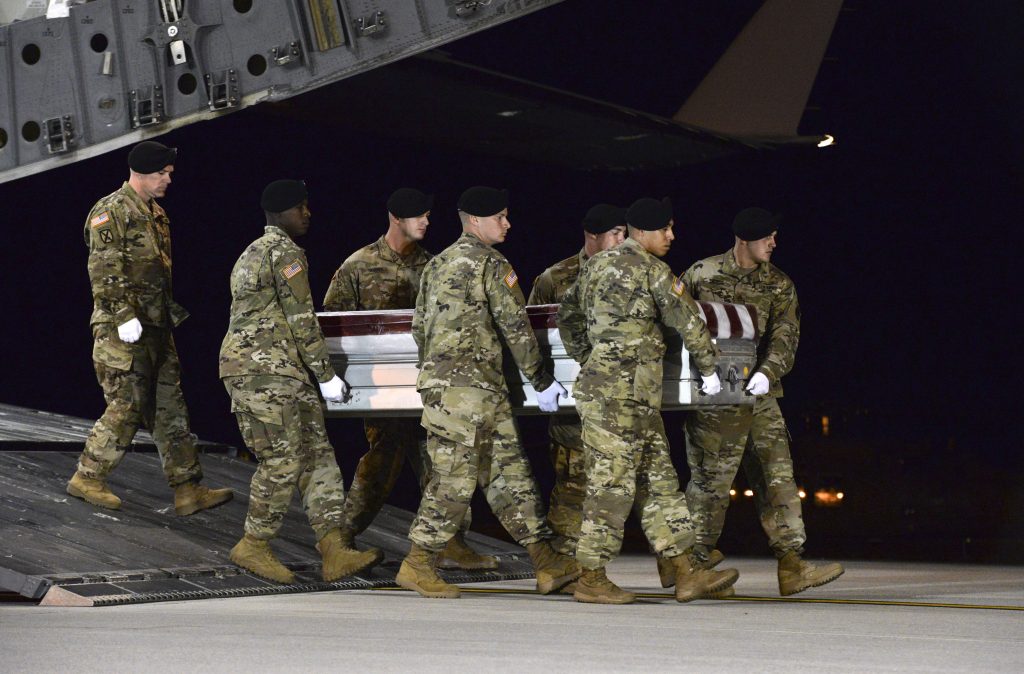 US Niger Casualty Return In this image provided by the U.S. Air Force, a U.S. Army carry team transfers the remains of Army Staff Sgt. Dustin Wright of Lyons, Ga., late Thursday, Oct. 5, 2017, upon arrival at Dover Air Force Base, Del. Wright, 29, of Lyons, Ga., was one of four U.S. troops and four Niger forces killed in an ambush by dozens of Islamic extremists on a joint patrol of American and Niger Force.