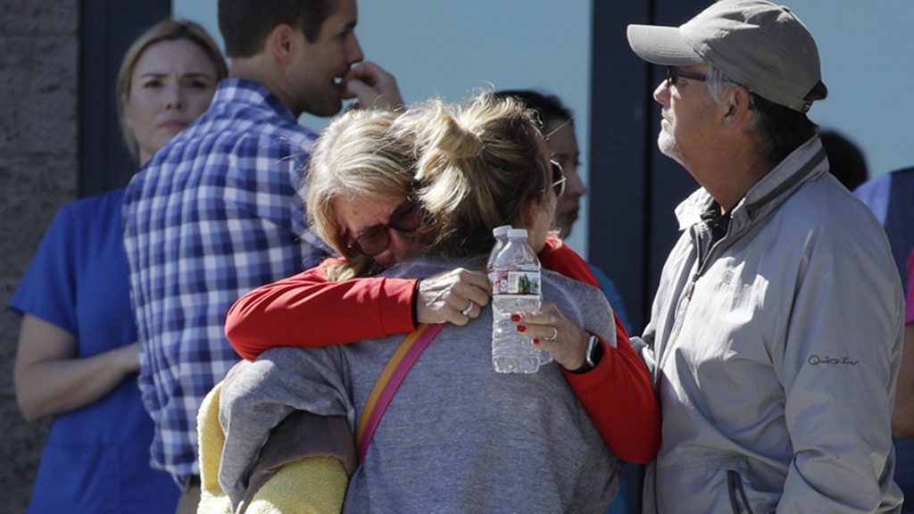 Las Vegas Shooting Two women embrace outside of a family assistance center