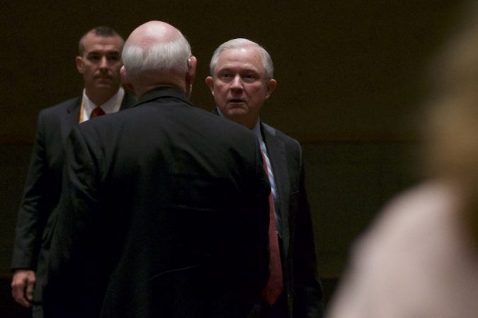 Sessions shaking hands after a speach