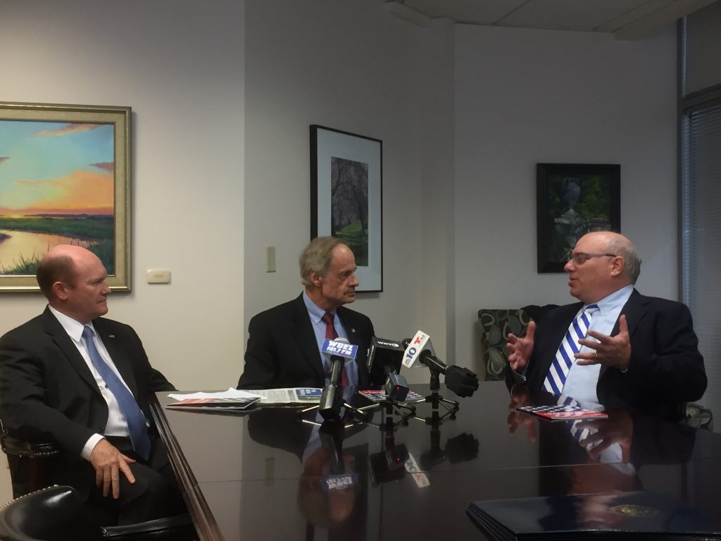 Carper Coons Pearl Delaware U.S. Senators Chris Coons and Tom Carper talk with chairman of the group Patriotic Millionaires Morris Pearl. (Zoë Read/WHYY)