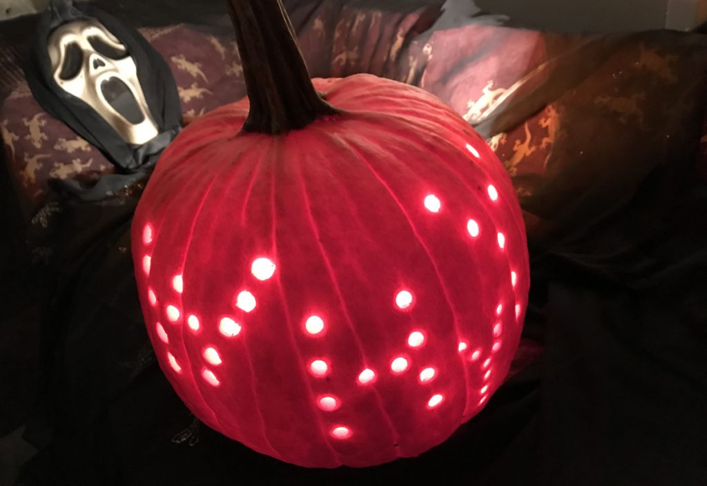 HYYpumpkinpicsx1200 A Scream mask to the left, a pumpkin carved to read WHYY