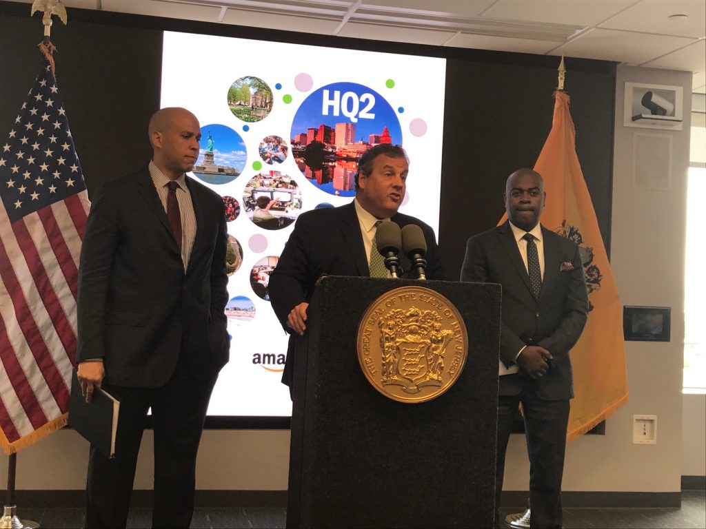IMG_5301 U.S. Sen. Cory Booker (from left), New Jersey Gov. Chris Christie, and Newark Mayor Ras Baraka say the city would be an ideal location for Amazon’s second headquarters. (Phil Gregory/WHYY)