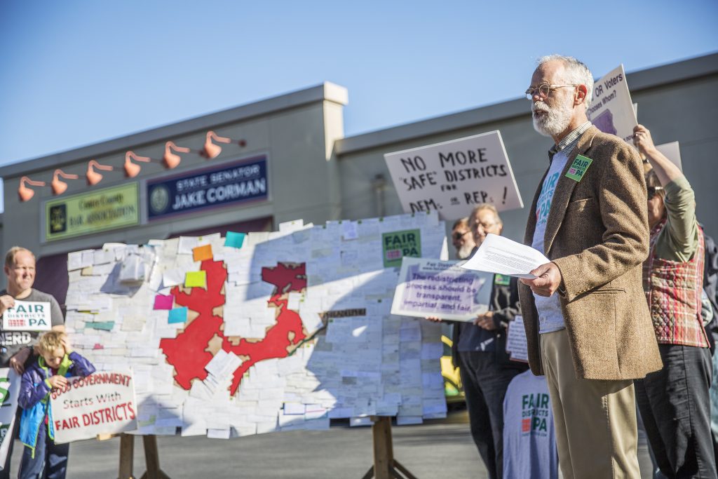 IMG_9078 Advocates supporting the lawsuit that eventually overturned the state's congressional map rallied outside Senate Majority Leader Jake Corman's office in Centre County in October 2017. (Min Xian/Keystone Crossroads)