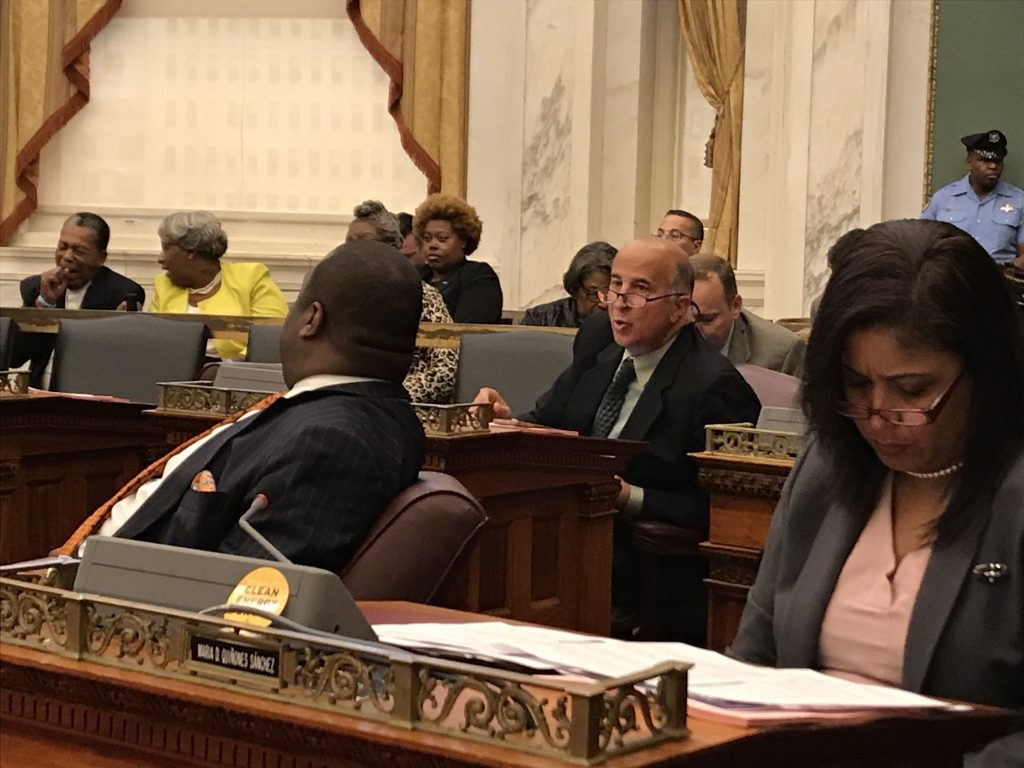 IMG_9337 Philadelphia Councilman Mark Squilla (second from right) speaks with a colleague at a City Council session Thursday. (Joel Wolfram/for WHYY)