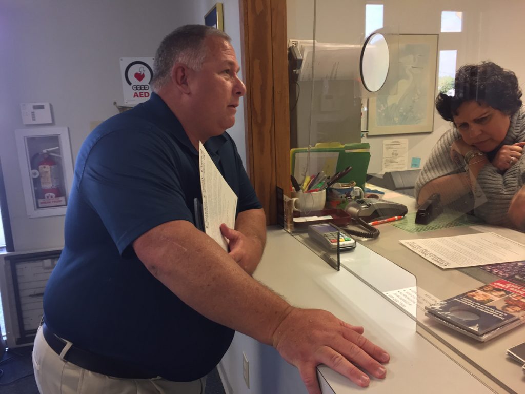 NWJHknockxLEDE A man stands at a window in a municipal building in New Jersey