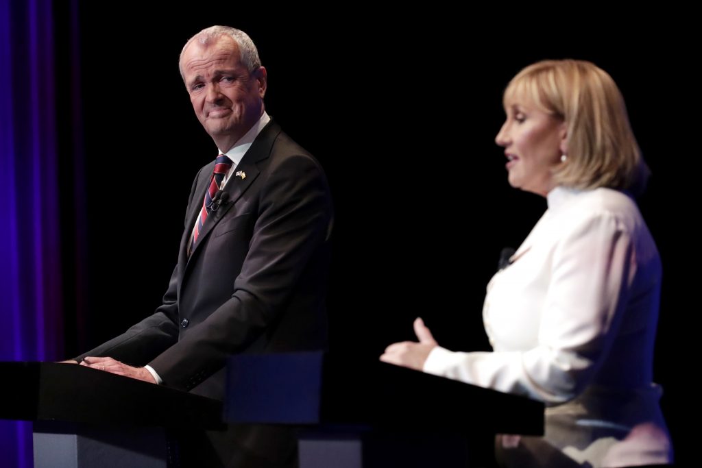 New Jersey Governors Race Democratic nominee Phil Murphy (left) listens as Republican nominee Lt. Gov. Kim Guadagno (right) answers a question during a gubernatorial debate at the New Jersey Performing Arts Center, Tuesday, Oct. 10, 2017, in Newark, N.J.