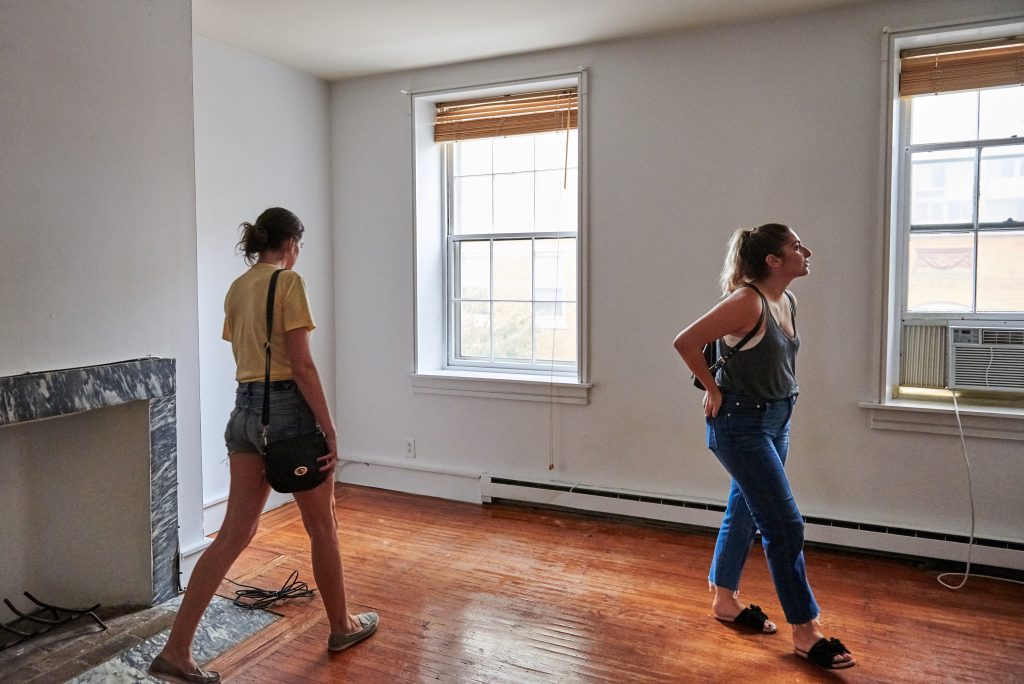 Real_Estate__DSC9446 Prospective renters Lisa Schaufler (left) and Alyssa Koenigsberg tour a brownstone in Society Hill. (Natalie Piserchio for WHYY)