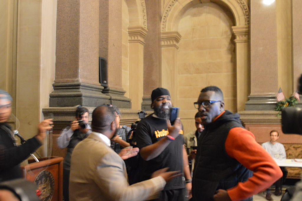 asa kalif and cj Black Lives Matter activist Asa Khalif (right) takes Philadelphia Councilman Curtis Jones from simulation to real life at City Hall Tuesday.