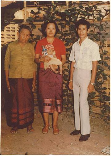 The author is shown as an infant, shortly after she was born in the Nongkhai Refugee Camp in Thailand.