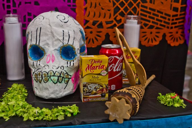 Treats are left for the deceased on the altar. (Kimberly Paynter/WHYY)