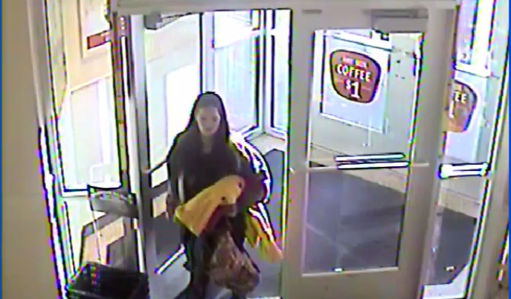 delawarecarjackingx1200 A white female, 25-35 years of age, 5’5″ tall, with a large build, long brown hair, wearing a gray hooded sweatshirt, black leggings and carrying a yellow blanket.