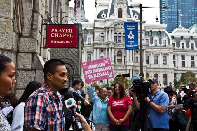 Javier Garcia Flores takes questions from the press outside the First United Methodist Church on Arch Street in Philadelphia, where he’s live since November 2016. (Kimberly Paynter/WHYY)