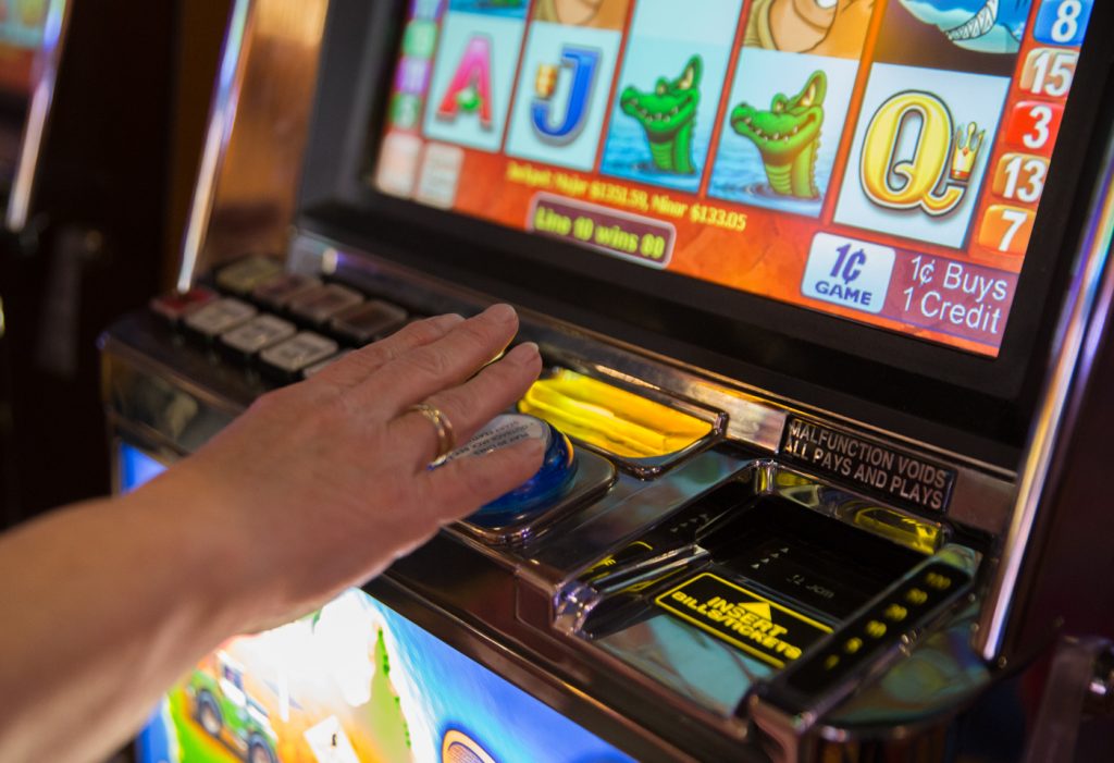 hollywood_casino_slots_1400 A woman plays the slots at Hollywood Casino at Penn National Race Course in Dauphin County, Pennylvania. (Lindsay Lazarski/WHYY)
