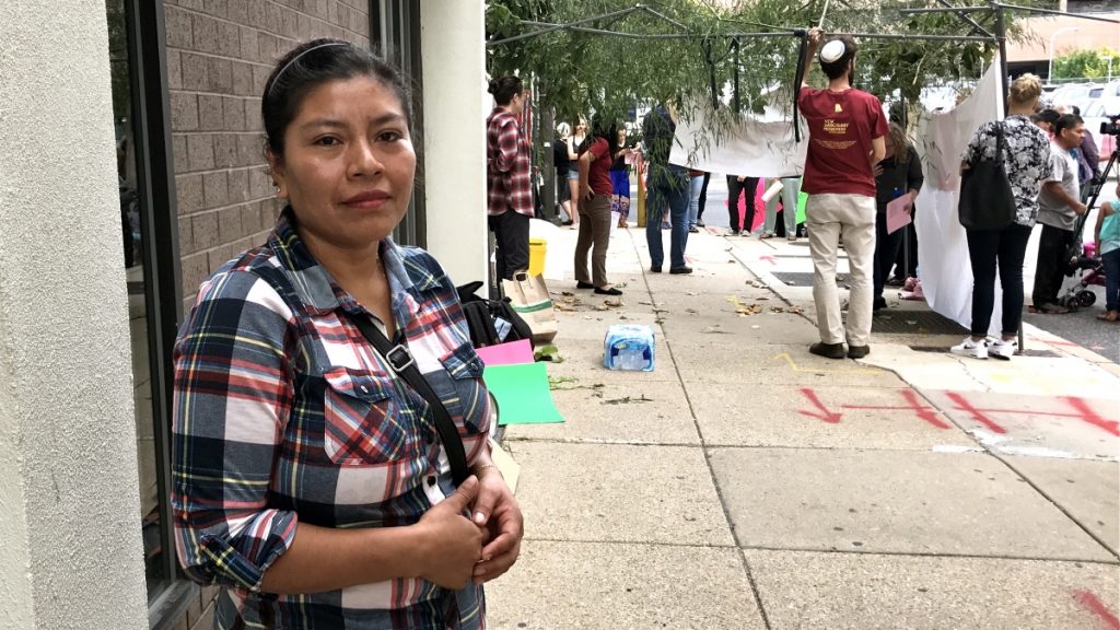 l_2017-10-05-l-benshoff-juana-from-guatemala A woman stands, hands folded in front of her