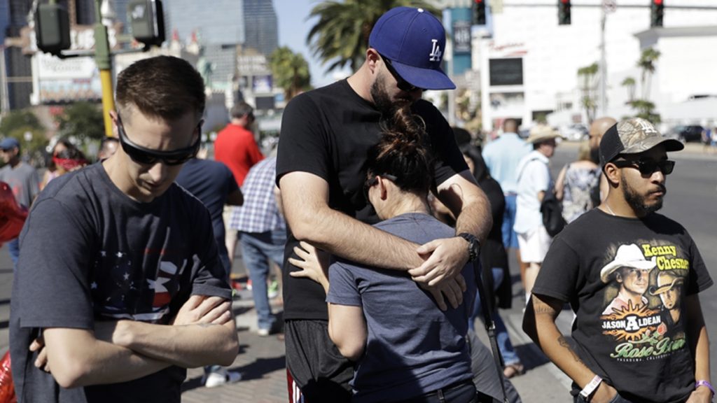 l_aplasvegasx1200 Reed Broschart, (center), hugs his girlfriend Aria James on the Las Vegas Strip in the aftermath of a mass shooting at a concert Monday, Oct. 2, 2017, in Las Vegas.