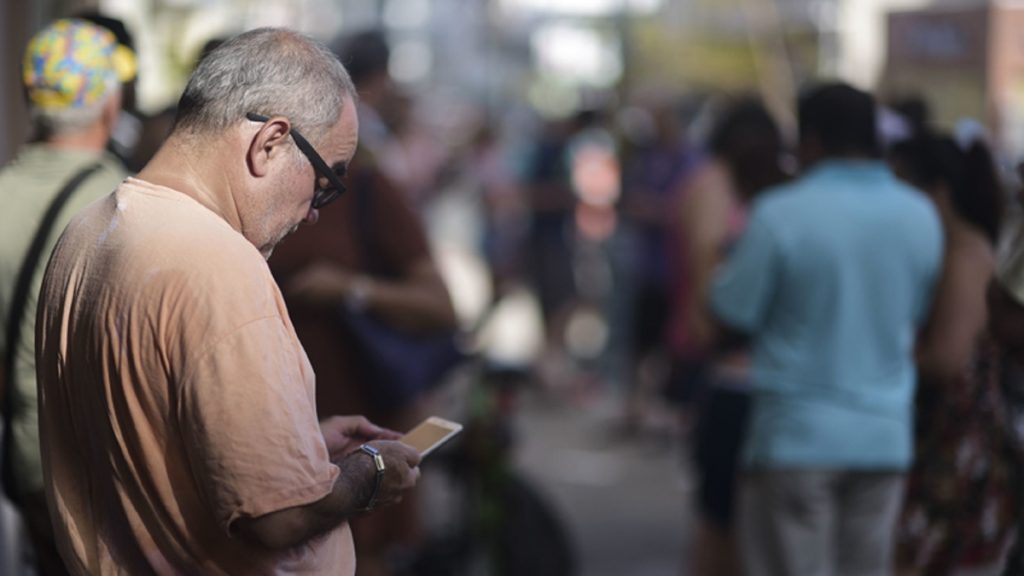 l_appuertoricowifix1200 A man stands at a Wi-Fi hotspot in the aftermath of Hurricane Maria with many cellphone towers down in San Juan, Puerto Rico, Sunday, Sept. 24, 2017. (Carlos Giusti/AP Photo)