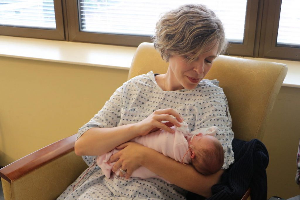 milk Jaime Martin holds her daughter, Ruby. She's 11 weeks old but was born so early that doctors still refer to her by her gestational age. (Emily Siner/WPLN)