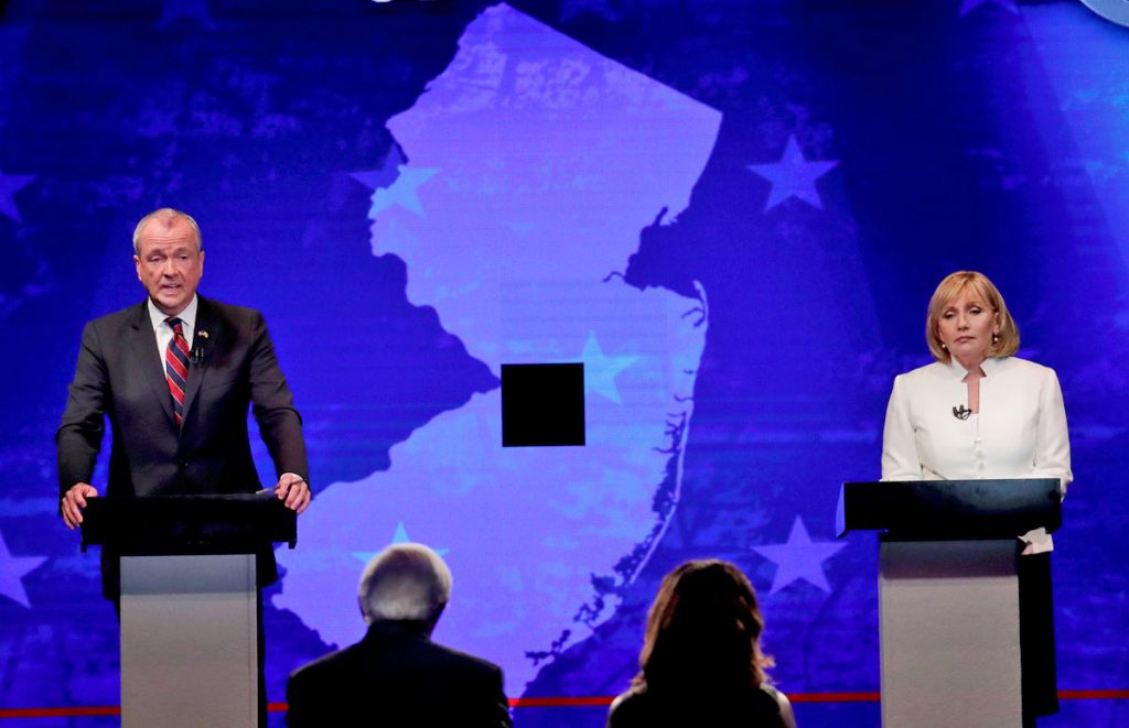 nj-debate-murphy-and-guadagno-1200 Democratic nominee Phil Murphy, left, and Republican nominee Lt. Gov. Kim Guadagno, right, participates in a gubernatorial debate at the New Jersey Performing Arts Center, Tuesday, Oct. 10, 2017, in Newark, N.J. (AP Photo/Julio Cortez, Pool)