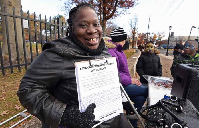 At a November 2016 block party to celebrate Camden High, education activist Vida Neil asked attendees to sign a petition to save the Castle. (April Saul/for Newsworks)