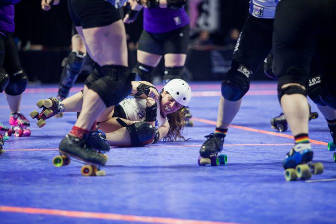 The Rose City Rollers of Portland, Oregon, face off against the Victorian Roller Derby League from Melbourne, Australia, in the championship game at the WFTDA International Championships at the Liacouras Center. (Brad Larrison for WHYY)