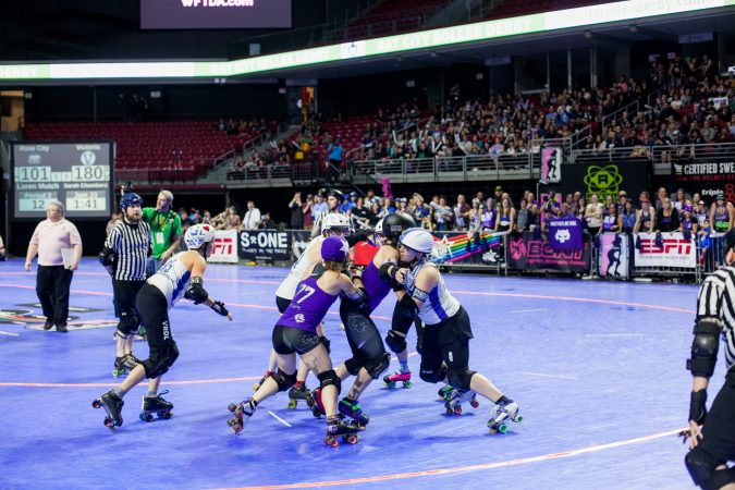 The Rose City Rollers of Portland, Oregon, face off against the Victorian Roller Derby League from Melbourne, Australia, in the championship game at the WFTDA International Championships at the Liacouras Center. (Brad Larrison for WHYY)