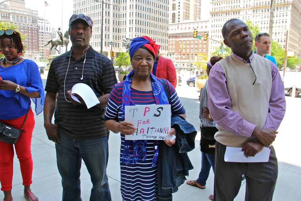 2017 05 18-e lee-philadelphia city hall-haiti temporary protective status Marie Belfort (center) and other Haitian Philadelphians gather outside City Hall to celebrate Haitian Flag Day