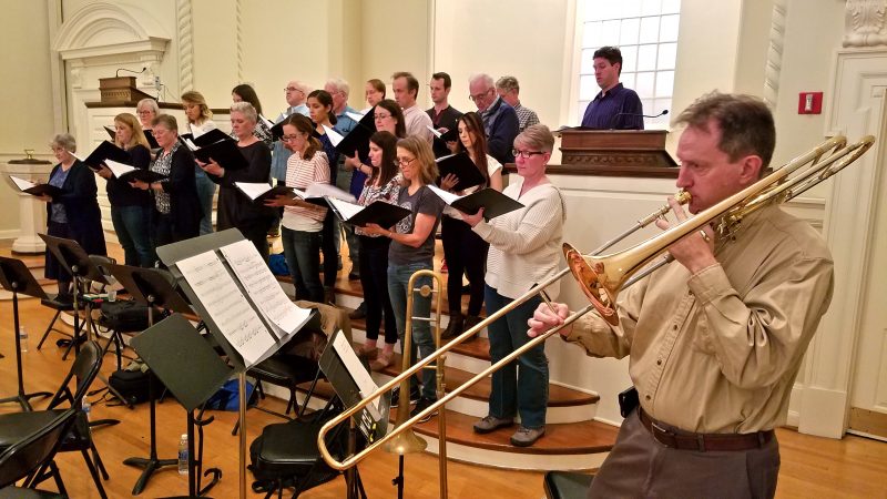A trombone player and a choir rehearse at the Presbyterian Church of Chestnut Hill