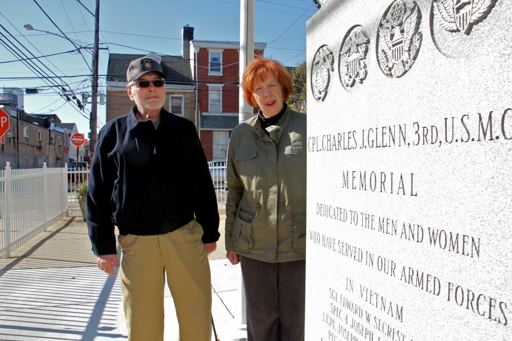 2017 11 08-e lee-jim lonergan joyce windfelder-philadelphia fishtown-charles glenn vietnam veterans memorial Jim Lonergan and Joyce Windfelder stand beside the Cpl. Charles J. Glenn Vietnam Veterans Memorial in Fishtown