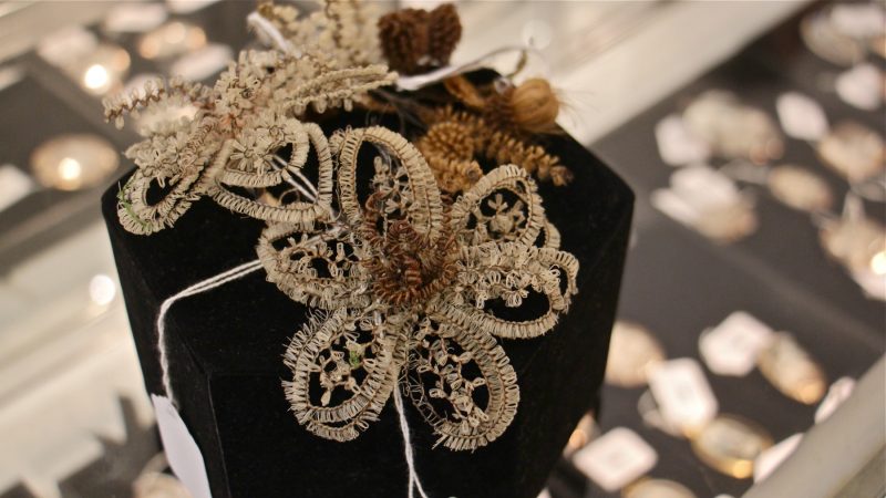 Shroud pins, woven with wire and hair and accented with floral sprigs, date to the 19th century.