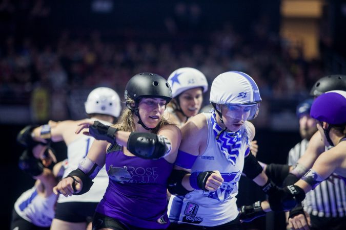 The Rose City Rollers of Portland, Oregon, face off against the Victorian Roller Derby League from Melbourne, Australia, in the championship game at the WFTDA International Championships at the Liacouras Center. (Brad Larrison for WHYY)
