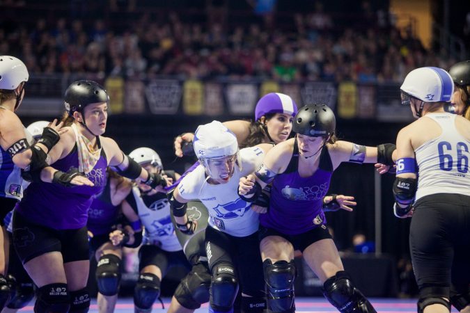 The Rose City Rollers of Portland, Oregon, face off against the Victorian Roller Derby League from Melbourne, Australia, in the championship game at the WFTDA International Championships at the Liacouras Center. (Brad Larrison for WHYY)