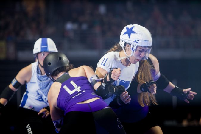 The Rose City Rollers of Portland, Oregon, face off against the Victorian Roller Derby League from Melbourne, Australia, in the championship game at the WFTDA International Championships at the Liacouras Center. (Brad Larrison for WHYY)