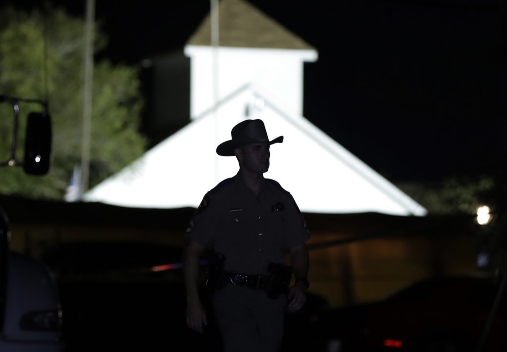 Church Shooting Texas A law enforcement official walks past the First Baptist Church of Sutherland Springs, the scene of a mass shooting, Sunday, Nov. 5, 2017, in Sutherland Springs, Texas.