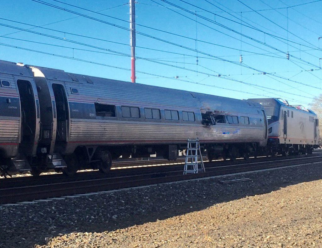 Train Derails Pennsylvania This photo shows an Amtrak train following a crash Sunday, April 3, 2016, in Chester, Pa. Amtrak said the train was heading from New York to Savannah, Ga., when it struck a backhoe outside of Philadelphia. (Glenn R. Hills Jr via A