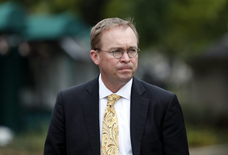 In this Sept. 13, 2017 file photo, Director of the Office of Management and Budget Mick Mulvaney departs after a television interview at the White House in Washington.  Senior Trump administration officials said Saturday, Nov. 25,  that they expect no trouble when President Donald Trump's pick for temporary director of the Consumer Financial Protection Bureau shows up for work, despite the clash on who should take over.   Trump announced he was picking Mulvaney within a few hours of Richard Cordray's announcement on Friday. (Alex Brandon/AP Photo, file)