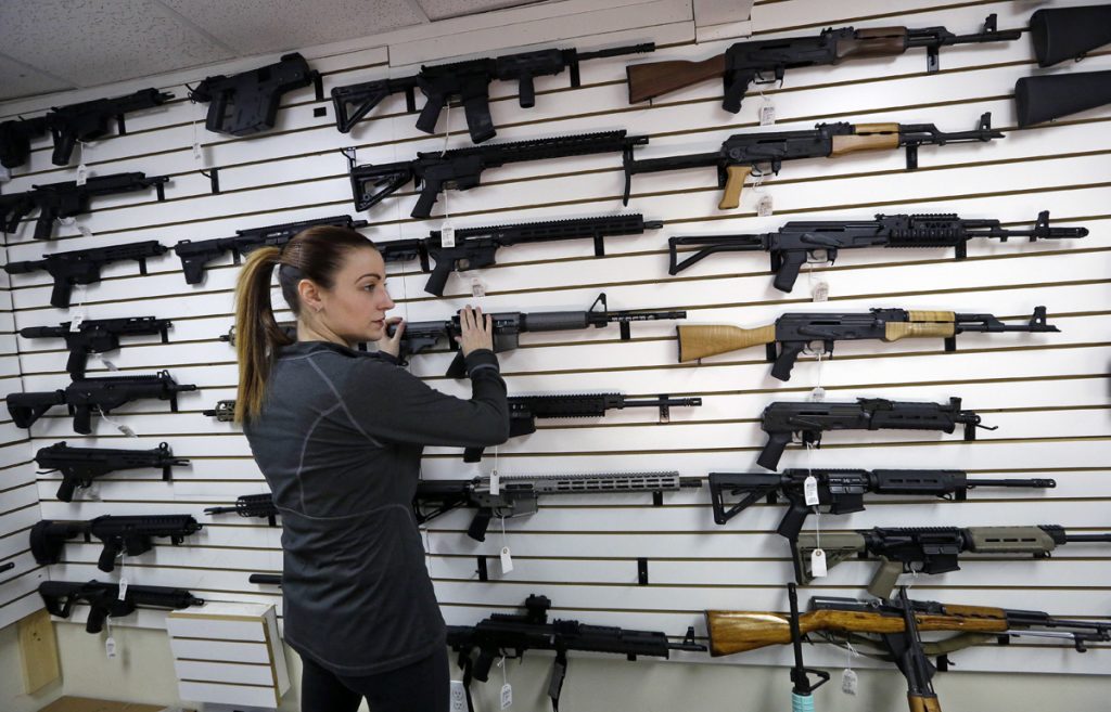 Church Shooting Gun Debate Gun shop owner Tiffany Teasdale-Causer returns a Ruger AR-15 semi-automatic rifle, the same model, though in gray rather than black, used by the shooter in a Texas church massacre two days earlier, to it's place on a wall with dozens of other semi-automatic rifles, Tuesday, Nov. 7, 2017, in Lynnwood, Wash. Gun-rights supporters have seized on the Texas church massacre as proof of the well-worn saying that the best answer to a bad guy with a gun is a good guy with a gun. Gun-control advocates, meanwhile, say the tragedy shows once more that it is too easy to get a weapon in the U.S. (Elaine Thompson/AP Photo)