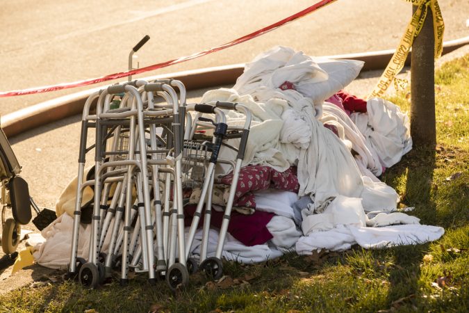 A pile of blankets and walkers set by the side of the road are seen in the aftermath of a fire at the the Barclay Friends Senior Living Community in West Chester, Pa., Friday, Nov. 17, 2017.   At least 20 people have been injured in a massive fire at the senior living community about 35 miles west of Philadelphia. (Matt Rourke/AP Photo)