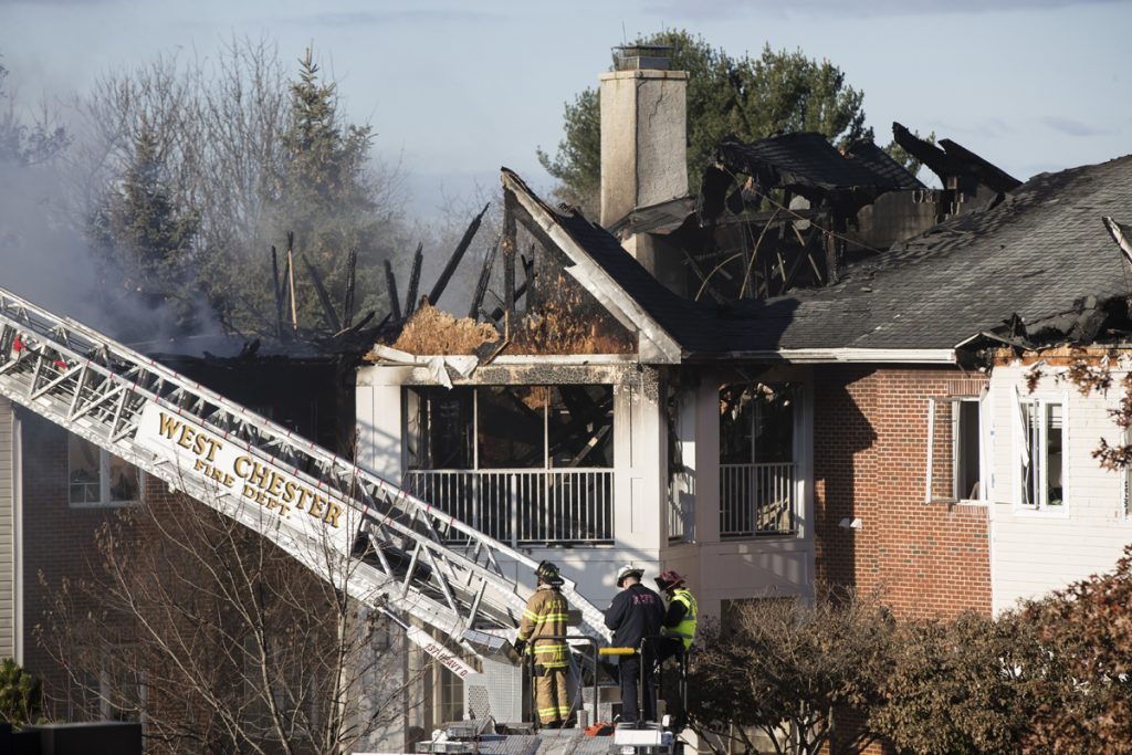 Senior Living Community Fire Firefighters continue to work the scene of a fire at the the Barclay Friends Senior Living Community in West Chester, Pa., Friday, Nov. 17, 2017. (