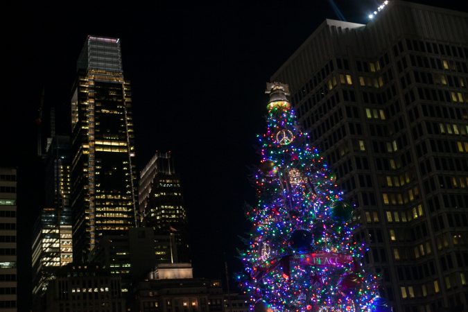 The lit Christmas tree outside of City Hall Friday evening. (Brad Larrison for WHYY)