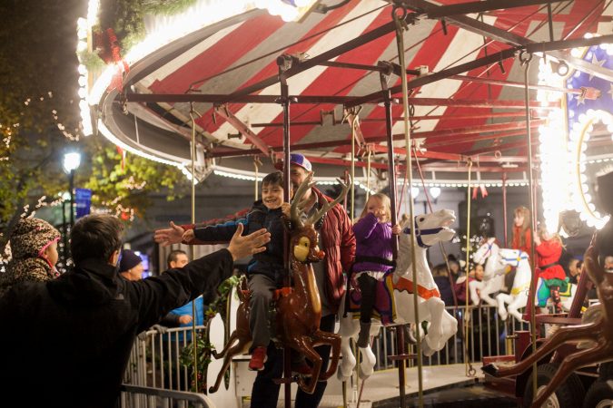 A carousel installed in the City Hall courtyard for the Christmas Village. (Brad Larrison for WHYY)
