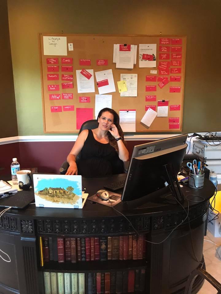 Donna Roggio sits in the office at her home in Buckingham. Township officials have ordered her to stop renting her house through Airbnb. (Laura Benshoff/WHYY)
