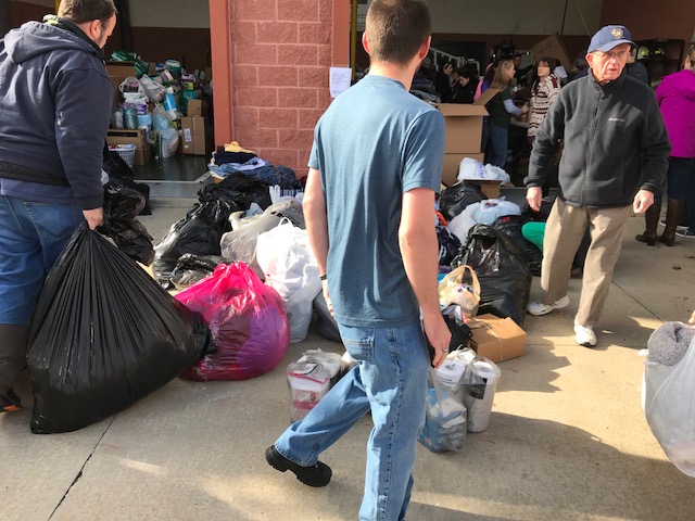 IMG_1334 Volunteers at Good Will Fire Company No. 2 help sort through donations for residents displaced by the five-alarm fire at Barclay Friends Senior Living Community in West Chester, Pa. (Shai Ben-Yaacov, WHYY)