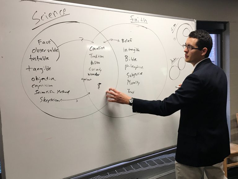 Matthew Groves, a divinity student, leads a Bible study class on science. Groves has made it his mission to educate faith communities on the ways science and religion can co-exist. (Natasha Senjanovic for WHYY)