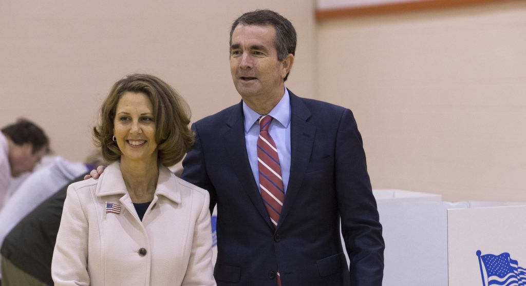 Ralph Northam,Pam Northam Democratic gubernatorial candidate Lt. Gov. Ralph Northam, right, and his wife, Pam, carry their ballots to the tally machine in Norfolk, Va.